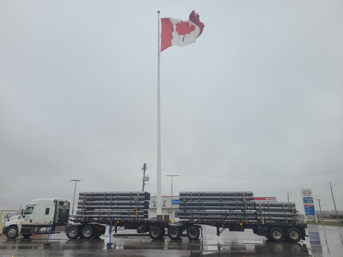 Lipsett Cartage Super B loaded with pipe